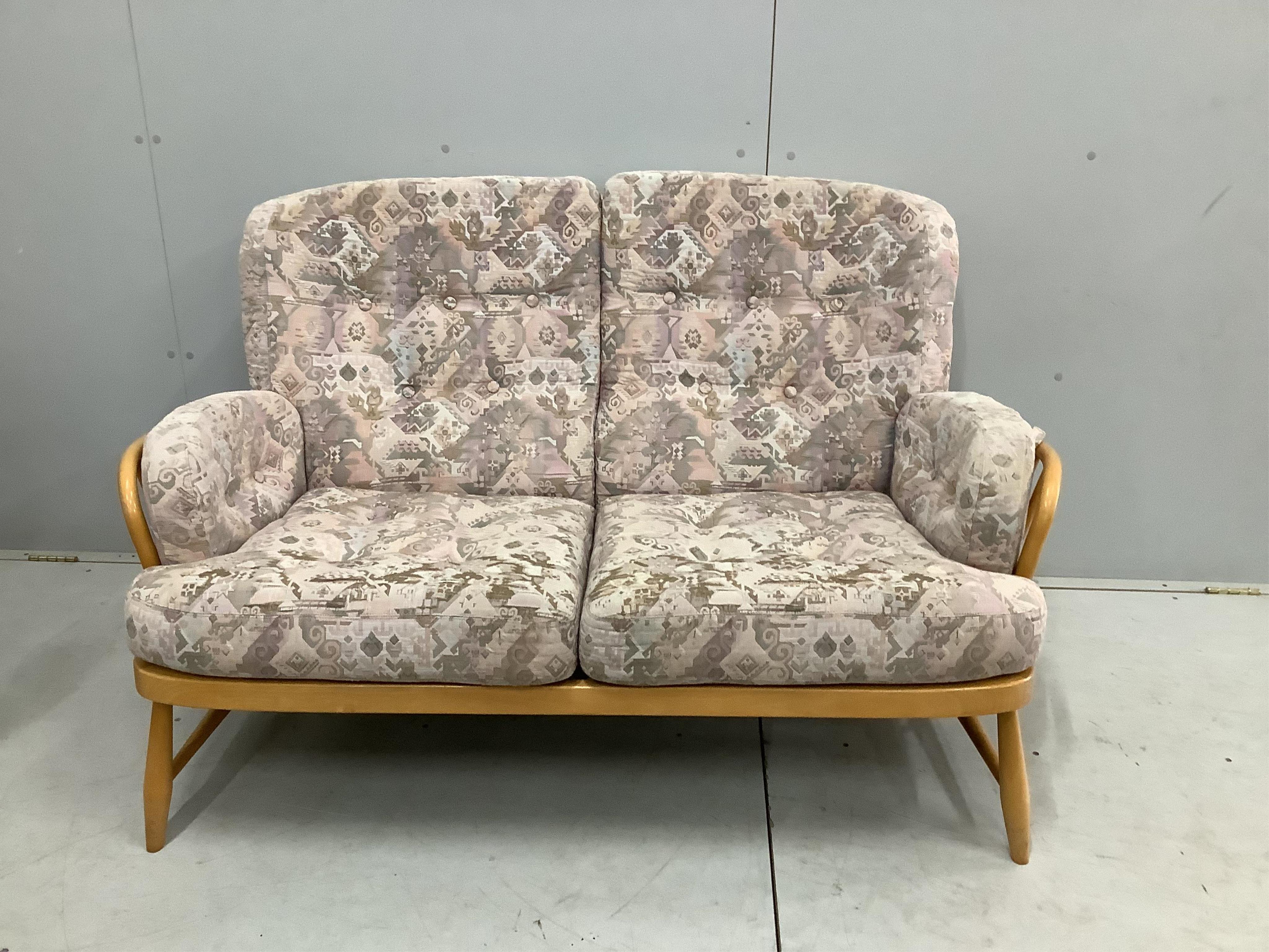 A pair of Ercol beech settees, width 140cm, depth 80cm, height 82cm